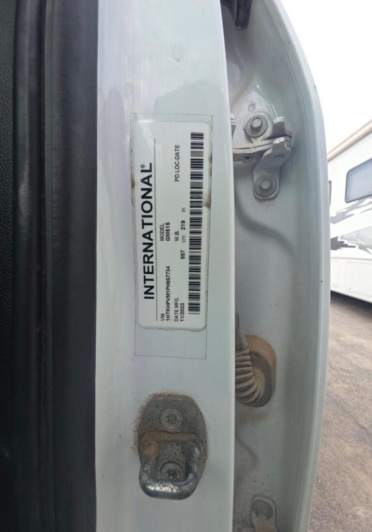 Traffic control truck with rear attenuator, message board, and storage racks