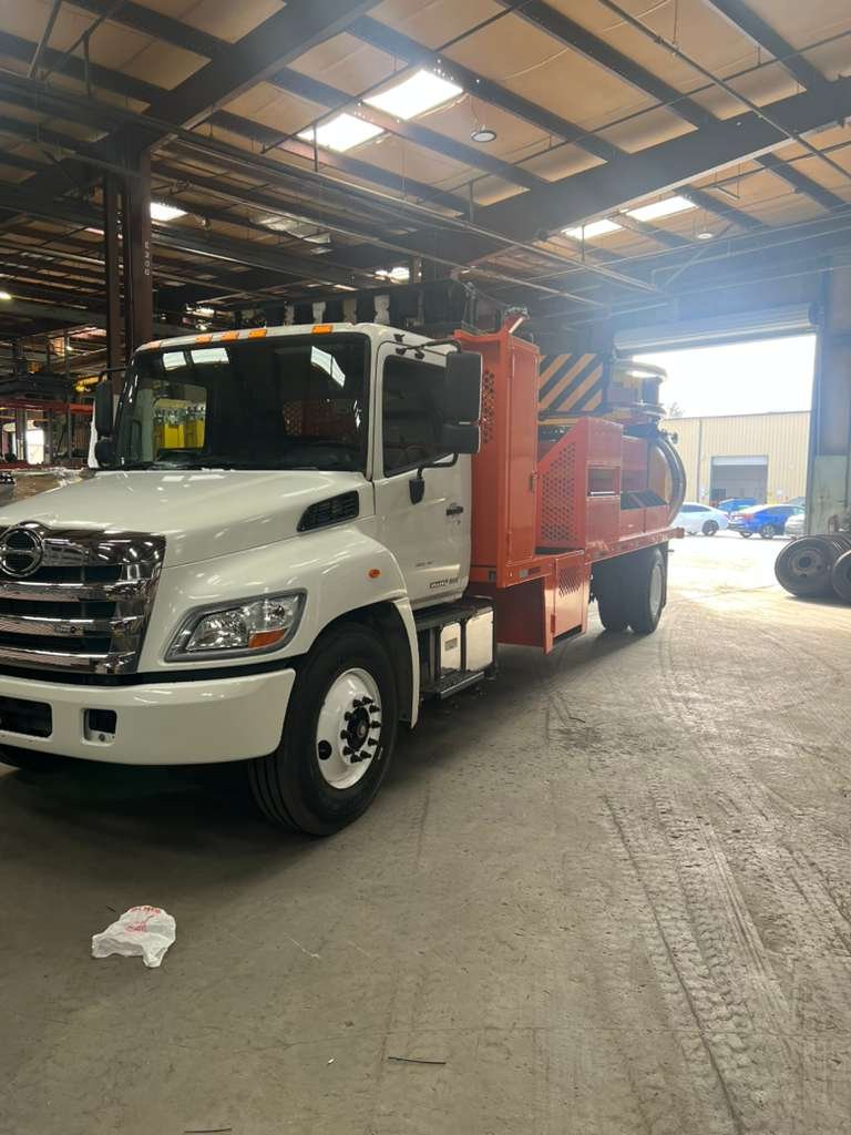 How to Spec, Evaluate, and Keep a Traffic Safety Truck Working for the Long Haul 1 Traffic safety truck with attenuator, boards, and storage racks parked for inspection