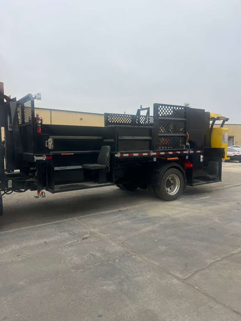A Practical Guide to Organizing Sign, Message Board, and Fleet Storage on Traffic Safety Trucks 1 Utility truck with organized traffic sign rack and work-zone equipment