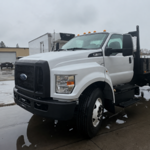 Two work-zone attenuator trucks parked for fleet comparison